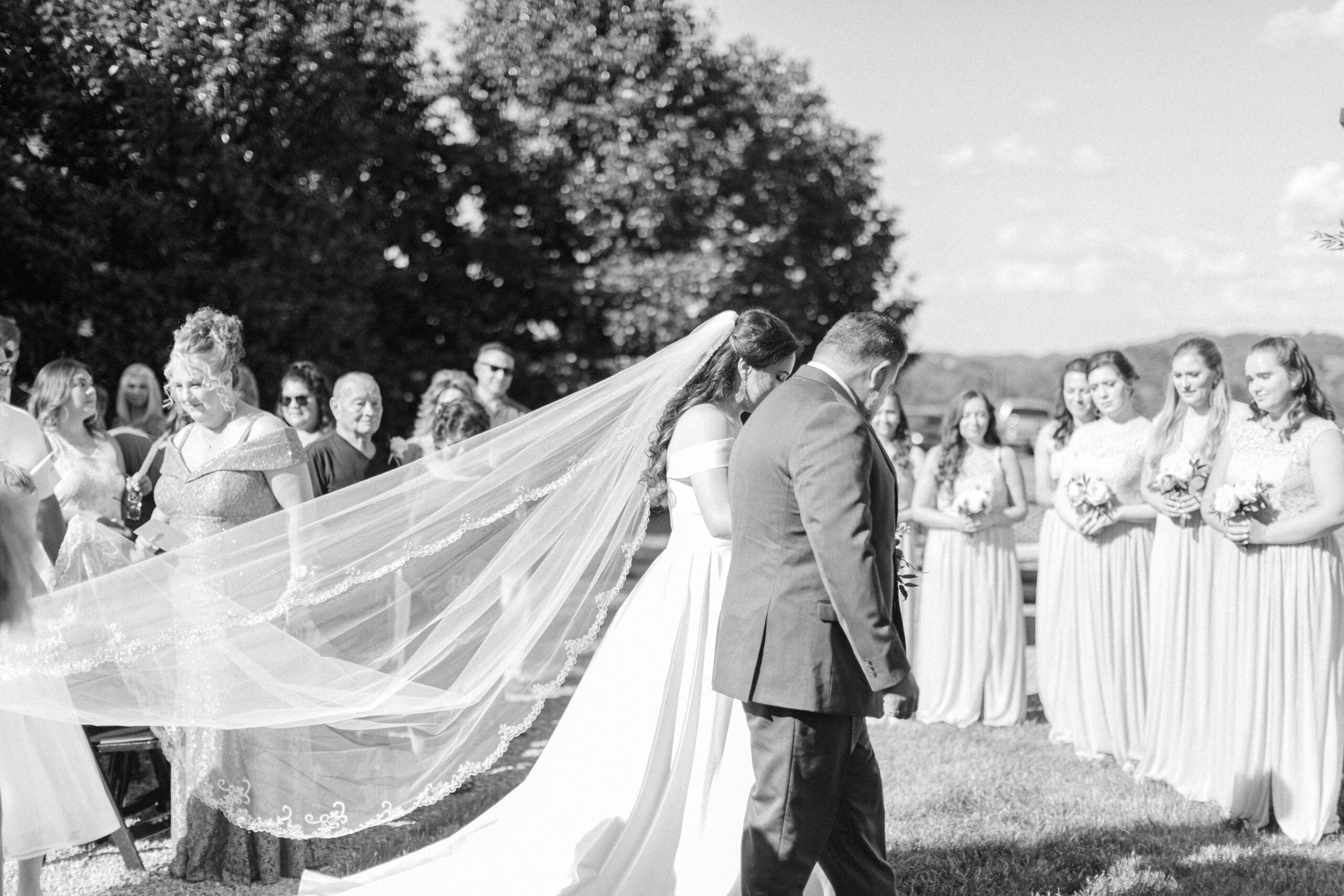 Black and white photo of bride walking down the aisle at Chateau Selah wedding Blountville, Tennessee.