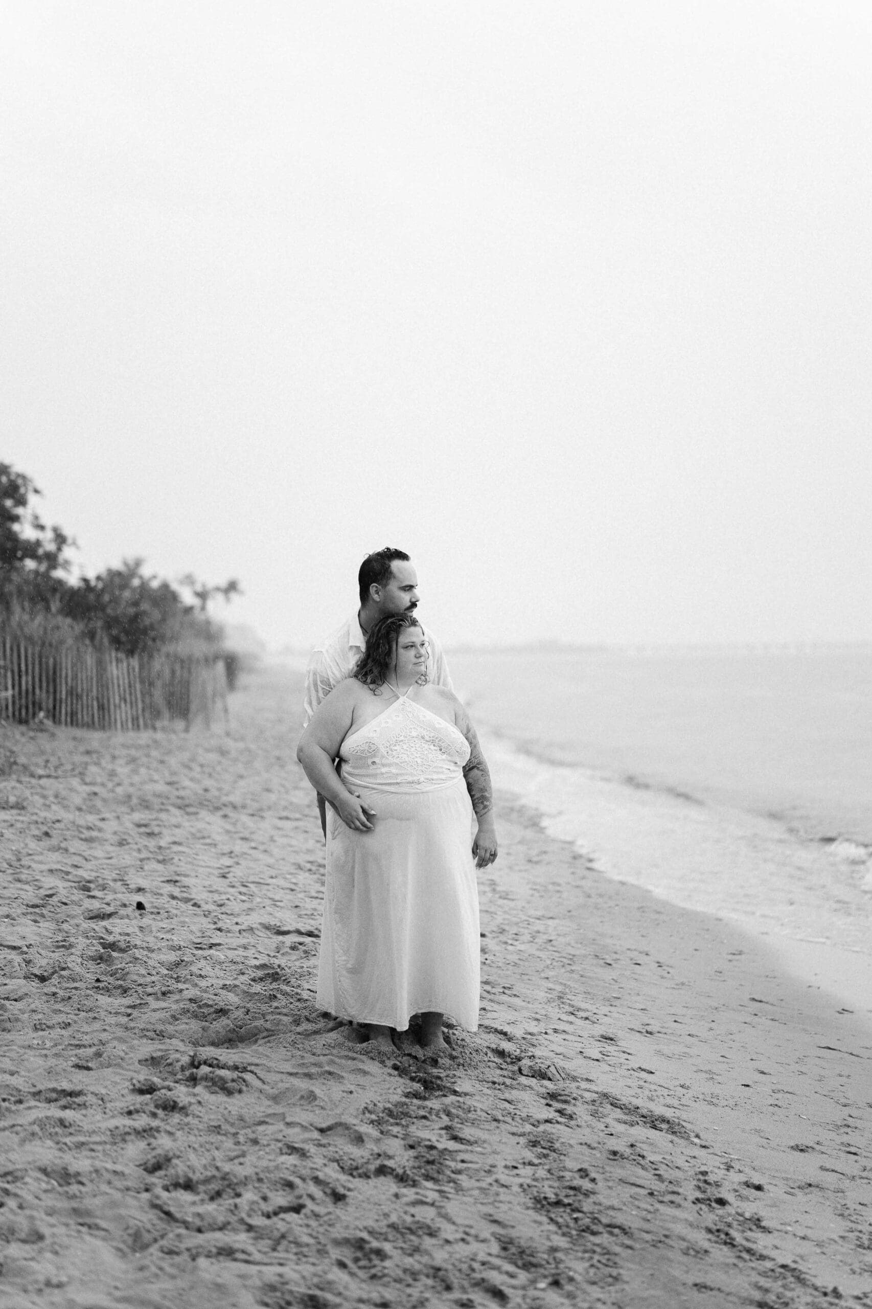 Black and white photo of a couple at their beach East Coast engagement session